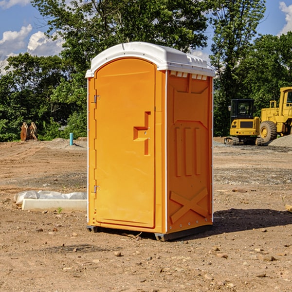 what is the cost difference between standard and deluxe portable restroom rentals in Bally